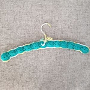 Vintage handmade knit clothing hanger